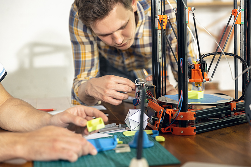 person using 3d printer