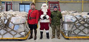 Santa and helpers with gifts